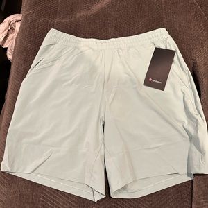 Light green Lululemon pace breaker shorts with liner